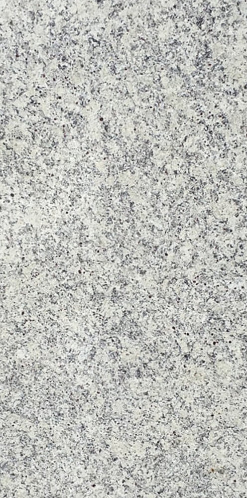 Close-up of a speckled gray and white stone surface with a rough texture.