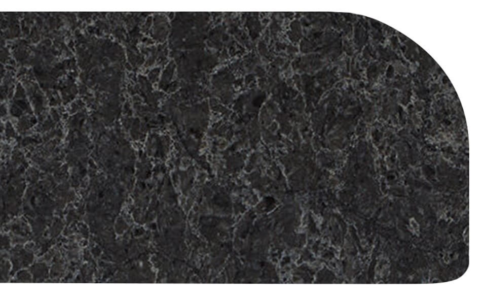 1.2-bullnosed Dark gray, marble-like countertop with rounded edge and subtle lighter gray veining throughout.